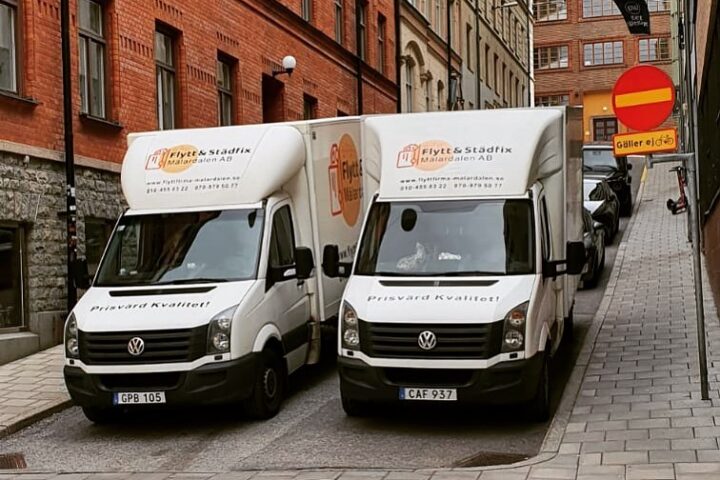 Two of Flytt & Städfix removal vans